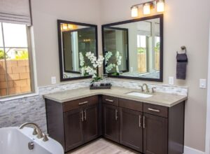 Renovated bathroom with coordinating cabinets and vanities 